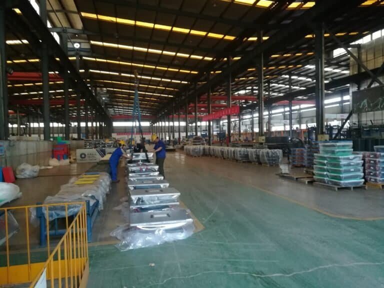 Fixed pot bearing assembly and packing in workshop – steel pot, PTFE plate, and sealing ring prepared for shipment